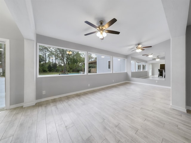 unfurnished living room with light hardwood / wood-style flooring, plenty of natural light, and ceiling fan