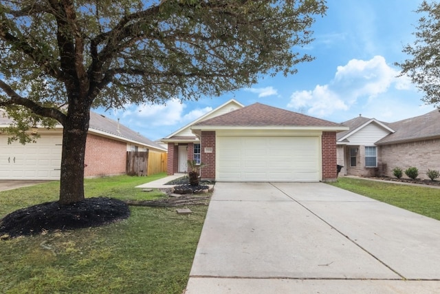 ranch-style home with a garage and a front lawn