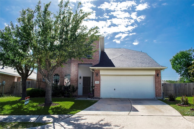 view of front of home with a garage and a front lawn