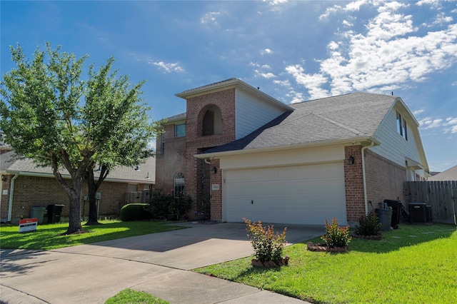 view of front of house featuring a garage, central air condition unit, and a front lawn