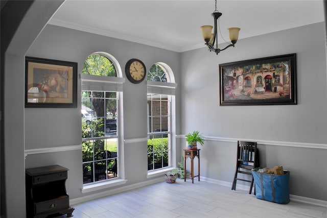 interior space featuring ornamental molding and a chandelier