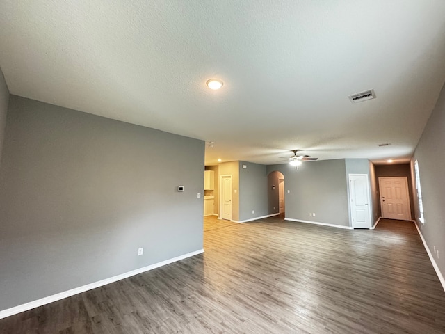 empty room featuring wood-type flooring and ceiling fan