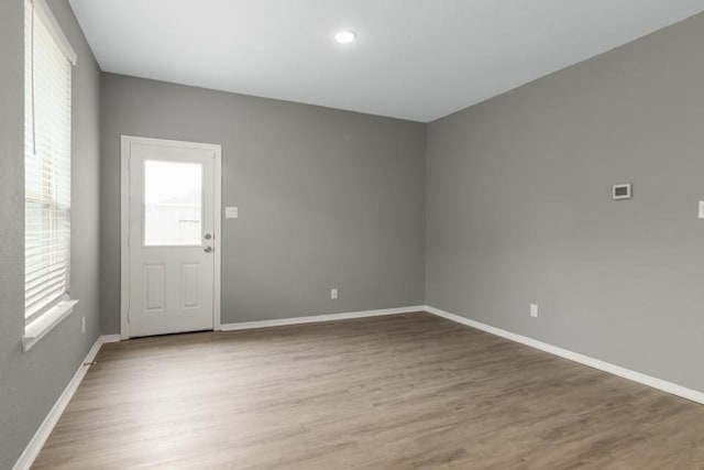 unfurnished room featuring hardwood / wood-style floors