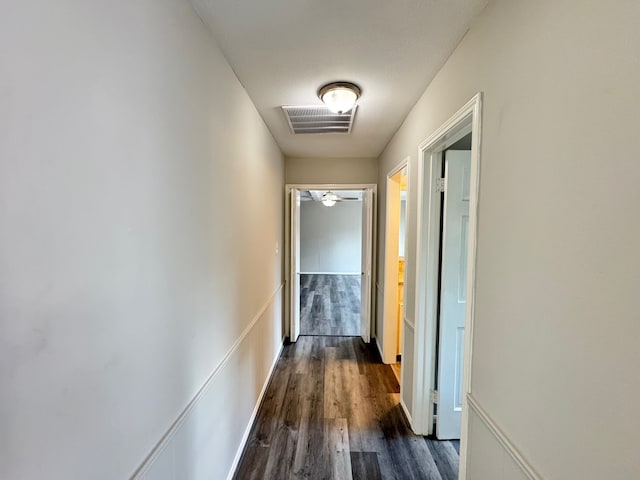 corridor with dark hardwood / wood-style floors