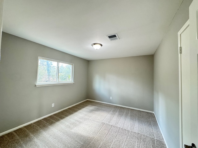 unfurnished room featuring carpet floors