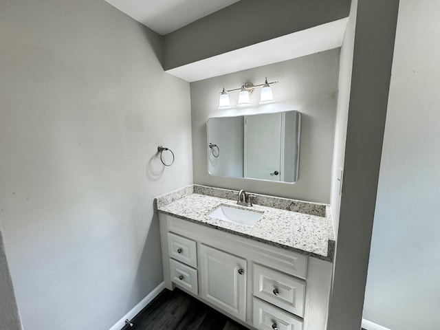 bathroom featuring vanity and hardwood / wood-style floors