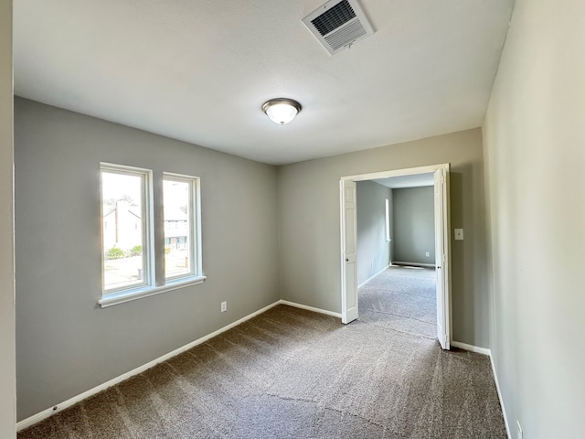 spare room with carpet floors