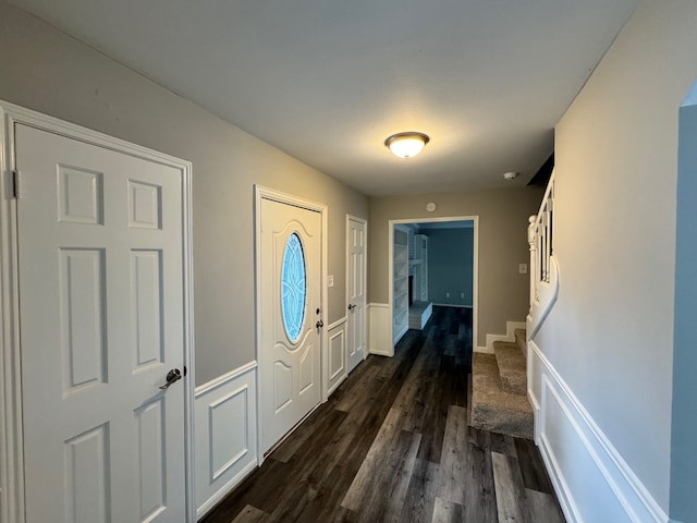 foyer entrance with dark wood-type flooring