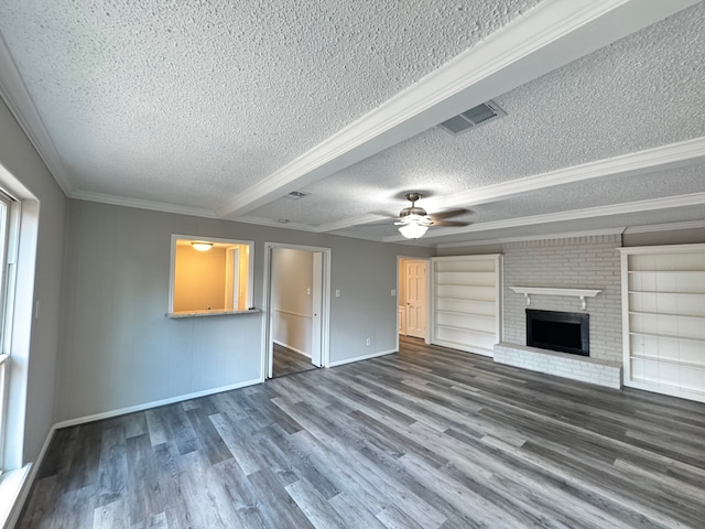 unfurnished living room featuring dark wood-type flooring and a textured ceiling