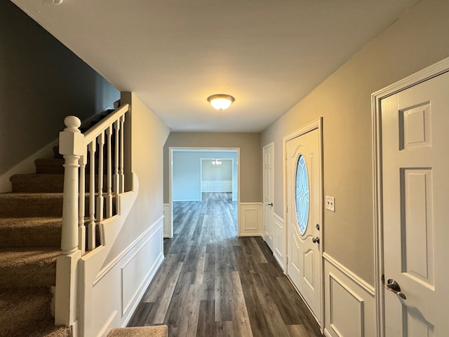 doorway with dark hardwood / wood-style flooring