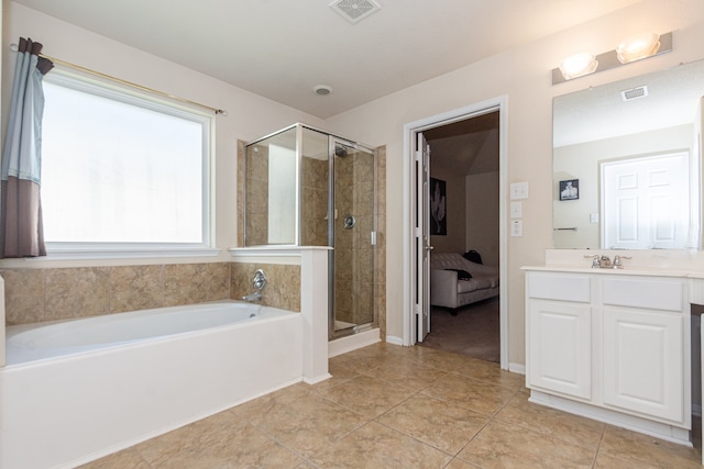 bathroom with vanity, tile patterned floors, and independent shower and bath