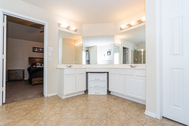 bathroom with vanity, tile patterned floors, and an enclosed shower