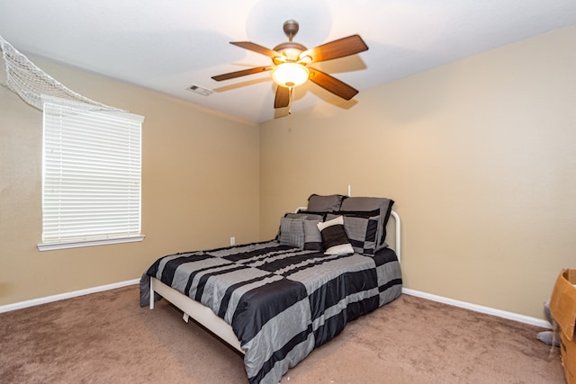 bedroom with ceiling fan and carpet