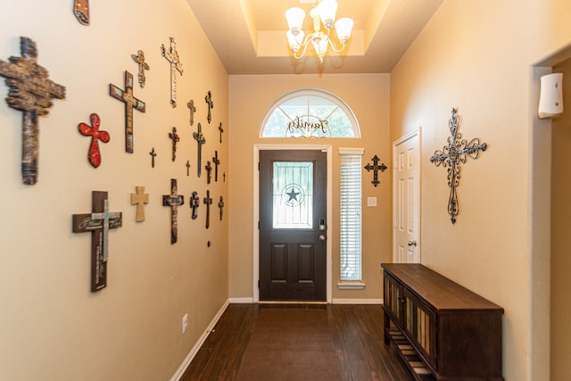 entrance foyer featuring a notable chandelier and dark hardwood / wood-style flooring