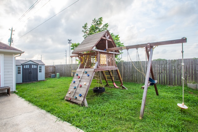 view of jungle gym featuring a shed and a lawn