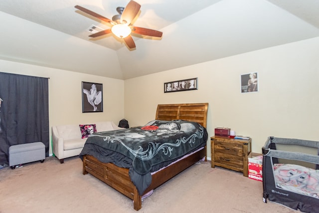 bedroom with carpet floors, vaulted ceiling, and ceiling fan