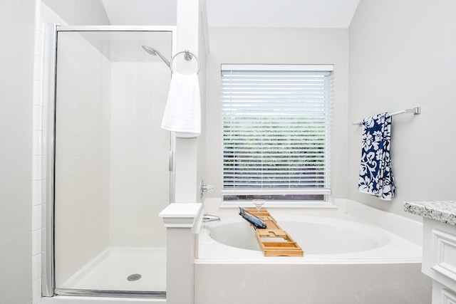 bathroom with plus walk in shower and vanity