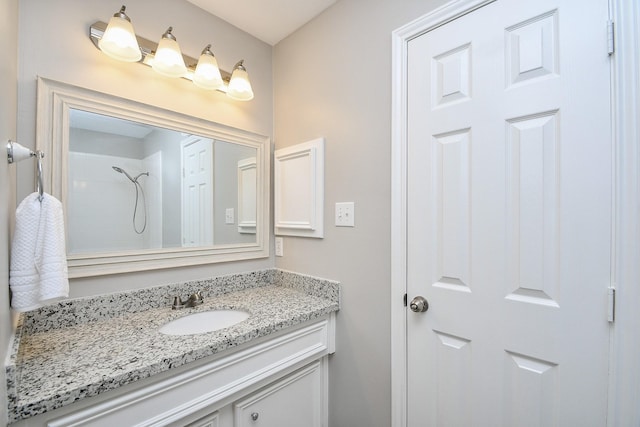 bathroom with vanity and walk in shower