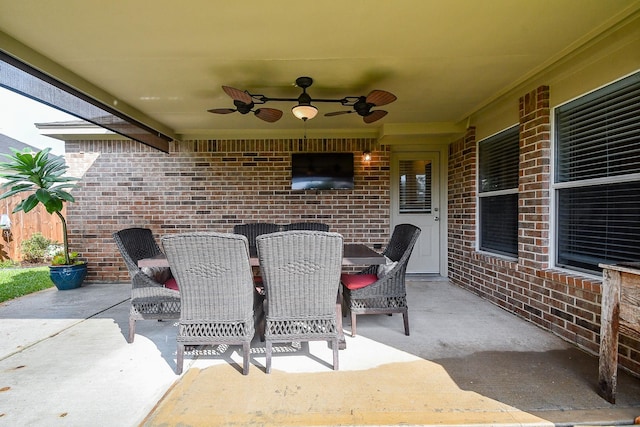 view of patio featuring ceiling fan