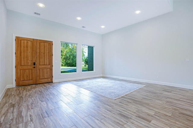 unfurnished room with light hardwood / wood-style flooring