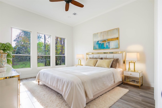 bedroom featuring ceiling fan and hardwood / wood-style flooring