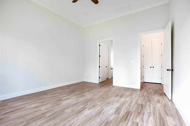 unfurnished bedroom with ceiling fan and light wood-type flooring