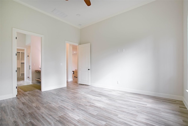 unfurnished bedroom featuring ceiling fan, light hardwood / wood-style flooring, and ornamental molding