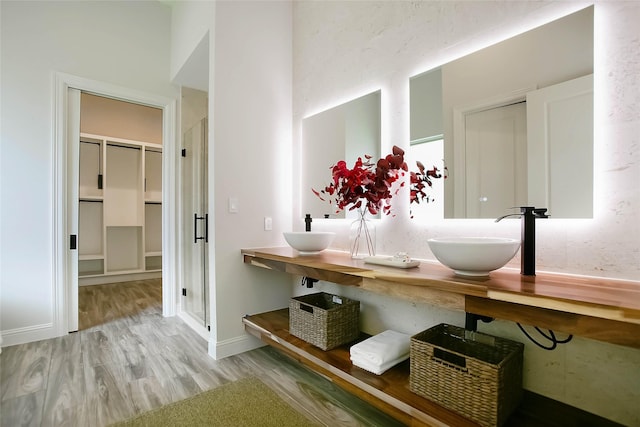 bathroom with hardwood / wood-style floors and vanity