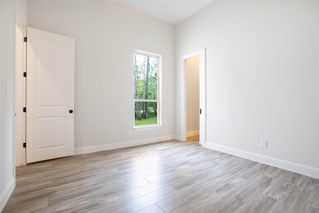 empty room with light hardwood / wood-style floors