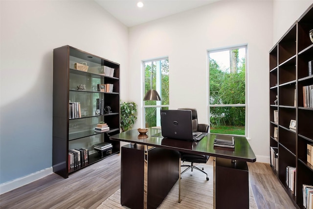 office area with wood-type flooring