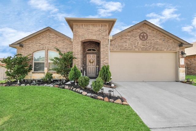 view of front of house featuring a front yard and a garage