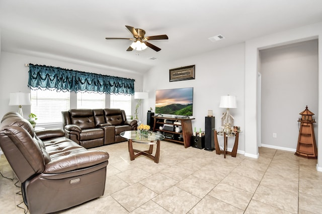 tiled living room with ceiling fan