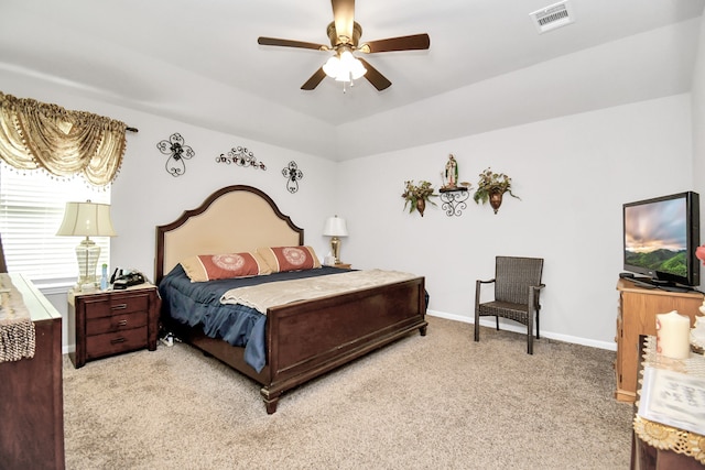 bedroom featuring light carpet and ceiling fan