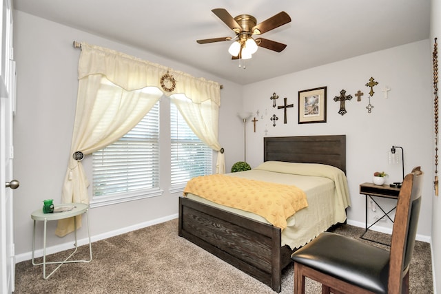 bedroom featuring ceiling fan and carpet