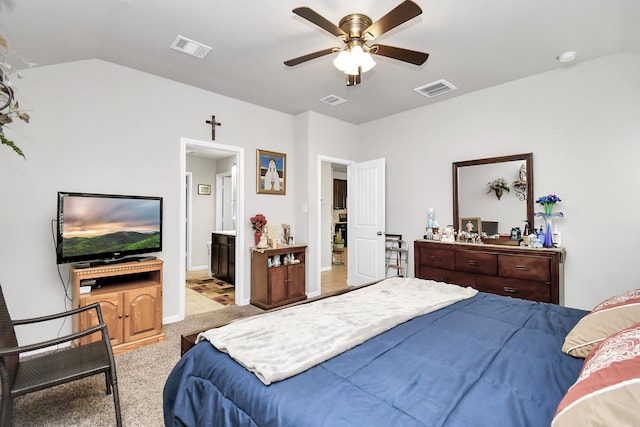 bedroom with connected bathroom, ceiling fan, lofted ceiling, and light colored carpet