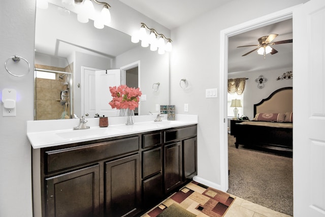 bathroom featuring vanity, a shower with shower door, and ceiling fan