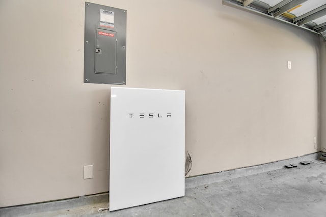 interior space featuring electric panel and concrete floors