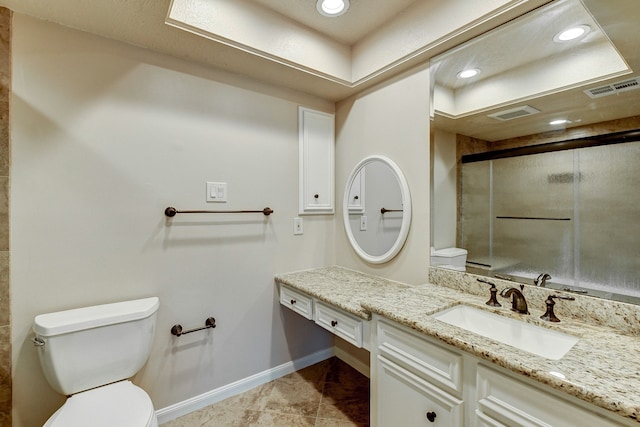 bathroom featuring vanity, toilet, tile patterned flooring, and an enclosed shower