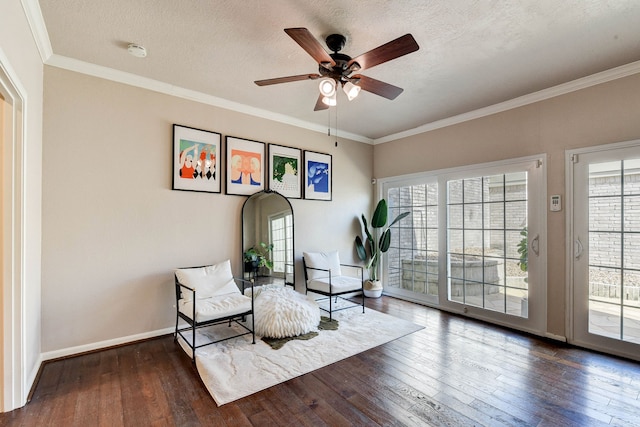 sitting room with ornamental molding, ceiling fan, a textured ceiling, and dark hardwood / wood-style flooring