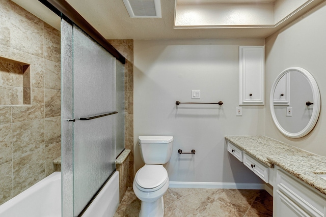 full bathroom featuring vanity, combined bath / shower with glass door, and toilet