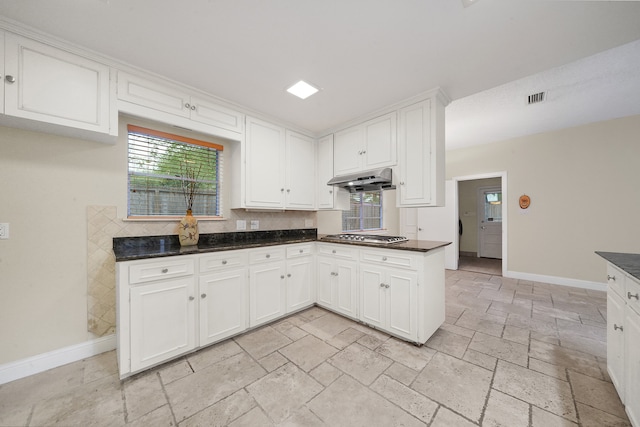 kitchen featuring white cabinets and stainless steel gas cooktop