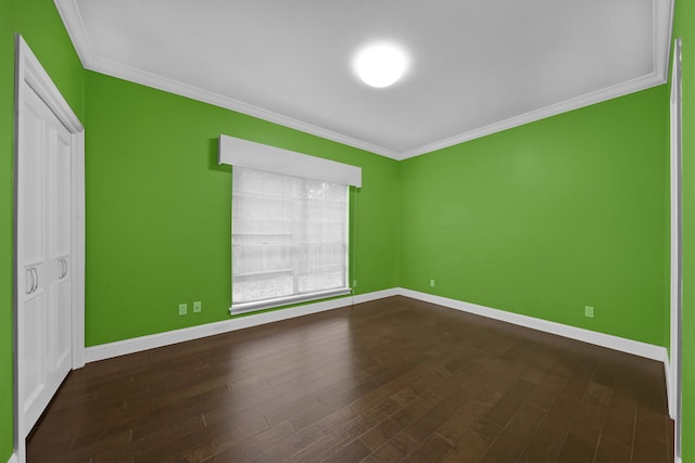 unfurnished bedroom featuring a closet, dark hardwood / wood-style flooring, and ornamental molding