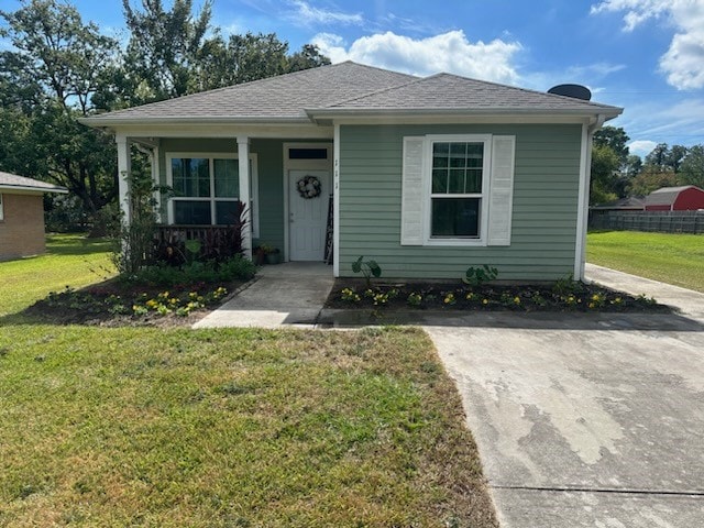 view of front of home featuring a front lawn and a porch