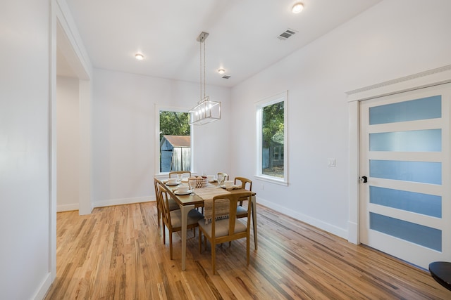 dining space featuring light wood-type flooring