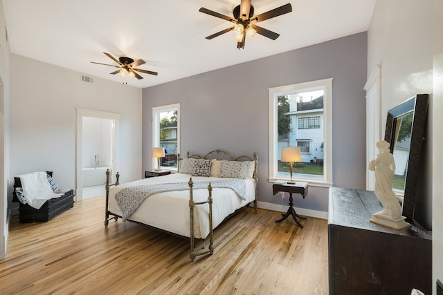 bedroom with light hardwood / wood-style flooring, multiple windows, and ceiling fan