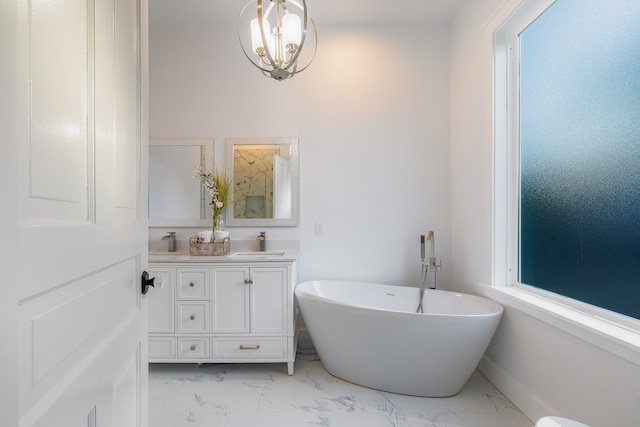 bathroom featuring vanity and a tub