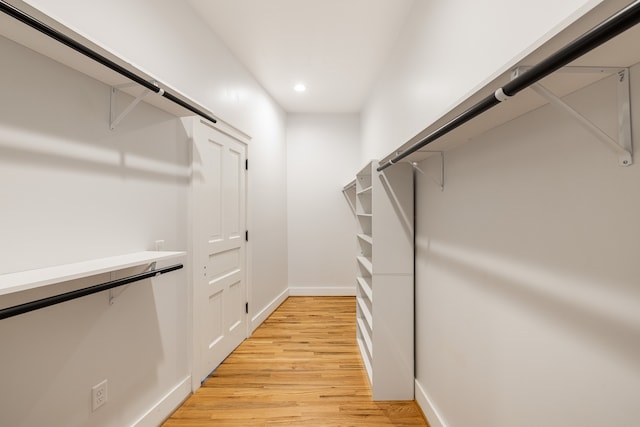 spacious closet featuring light wood-type flooring