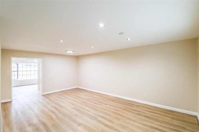 spare room with light hardwood / wood-style floors