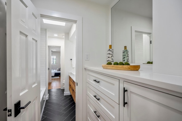 bathroom featuring vanity and wood-type flooring