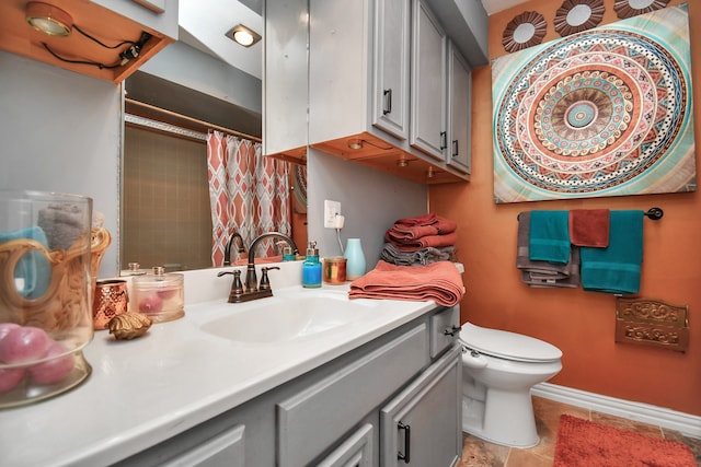 bathroom featuring a shower with curtain, tile patterned flooring, vanity, and toilet